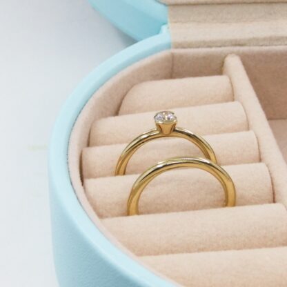 Solitaire diamond and gold twist ring set