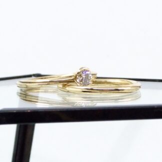 Solitaire diamond and gold twist ring set