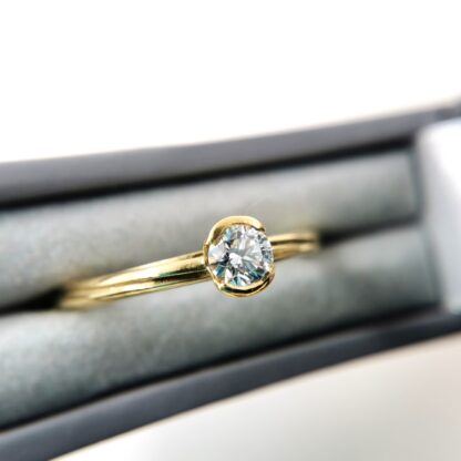 Solitaire diamond and gold twist ring