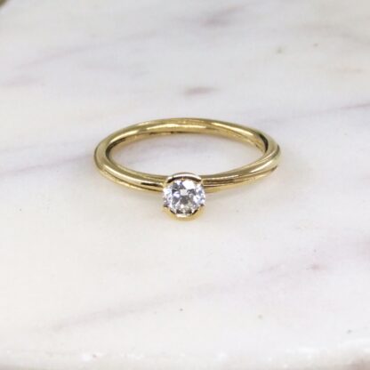 Solitaire diamond and gold twist ring